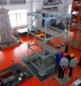 Earthquake-engineering researchers at the Harbin Institute of Technology in China work to set up a structure on a shake table for experiments to study the effects of earthquakes. Purdue University civil engineering students are working with counterparts at the institute to study the reliability of models for testing a type of powerful damping system that might be installed in buildings and bridges to reduce structural damage and injuries during earthquakes. Earthquake-engineering researchers at the Harbin Institute of Technology in China work to set up a structure on a shake table for experiments to study the effects of earthquakes. Purdue University civil engineering students are working with counterparts at the institute to study the reliability of models for testing a type of powerful damping system that might be installed in buildings and bridges to reduce structural damage and injuries during earthquakes.