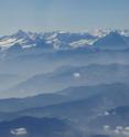 Mountain peaks in the Bernese Alps protrude above the top of a hazy layer of air. NASA, CIRES and other scientists have uncovered strong evidence that beginning in the 1860s, soot sent into the air by a rapidly industrializing Europe caused the abrupt retreat of mountain glaciers in the European Alps.