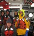 Left to right: Brian Gagliardi (Stony Brook University), Steffen Sastrup (UTIG), Beth Christensen (Adelphi University), Cassandra Browne (UT Austin), and Jamie Austin (UTIG) seek warmth in the cabin of Stony Brook University's R/V Seawolf during their January 2013 marine geophysical survey of the barrier sediment system offshore Long Island.