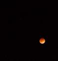 Lunar eclipse and more! Mars shines bright in the upper right of the image, and the star Spica from the constellation Virgo is below the moon. Additionally, 76 Virginis is just barely above the moon, too.