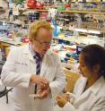 Dr. Steve A. Kay confers with a student in his lab.