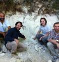 Left to right, Biaggio Giaccio, Gianluca Sotilli, Courtney Sprain and Sebastien Nomade sitting next to an outcrop in the Sulmona basin of the Apennines that contains the Matuyama-Brunhes magnetic reversal. A layer of volcanic ash interbedded with the lake sediments can be seen above their heads. Left to right, Biaggio Giaccio, Gianluca Sotilli, Courtney Sprain and Sebastien Nomade sitting next to an outcrop in the Sulmona basin of the Apennines that contains the Matuyama-Brunhes magnetic reversal. A layer of volcanic ash interbedded with the lake sediments can be seen above their heads.
