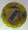Researchers at Caltech devised a way to calculate the electrical properties of individual components of a composite material by testing the material's response in a range of magnetic fields. This image shows the material wired in a sample holder designed to measure its electrical properties.