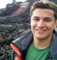 Esteban Gazel, a geoscientist at Virginia Tech, collects samples of lava in a variety of locations, in this case Etna, Italy, to probe the chemical evolution of the planet.