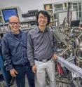 Andreas Schmid and Gong Chen at the SPLEEM instrument in the Molecular Foundry's electron microscopy center where they are conducting research on magnetic domain walls.