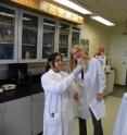 Washington State University doctoral student Malavika Sinha, left, examines new mutant of <i>Aspergillus carbonarius</i> with researcher Birgitte Ahring.