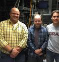 Frank Floss of Bulley & Andrews (left) , and University of Chicago researchers Andrew Yeats (center) and Peter Mintun, worked together to better understand how fluorescent lights in the Searle Chemistry Laboratory building was affected experimental data in unexpected and important ways.