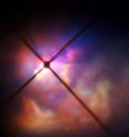 <p>The star VY Canis Majoris is a red hypergiant, one of the largest known stars in the Milky Way. It is 30-40 times the mass of the Sun and 300 000 times more luminous. In its current state, the star would encompass the orbit of Jupiter, having expanded tremendously as it enters the final stages of its life.

<p>New observations of the star using the SPHERE instrument on the VLT have clearly revealed how the brilliant light of VY Canis Majoris lights up the clouds of material surrounding it and have allowed the properties of the component dust grains to be determined better than ever before.

<p>In this very close-up view from SPHERE the star itself is hidden behind an obscuring disc. The crosses are artefacts due to features in the instrument.