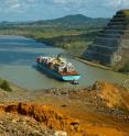 A cargo ship in the Panama Canal traverses volcanic rocks that helped form the Isthmus of Panama.