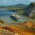 A cargo ship in the Panama Canal traverses volcanic rocks that helped form the Isthmus of Panama.